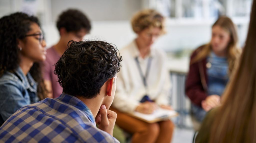 Group of individuals in a Christian recovery session in Colorado